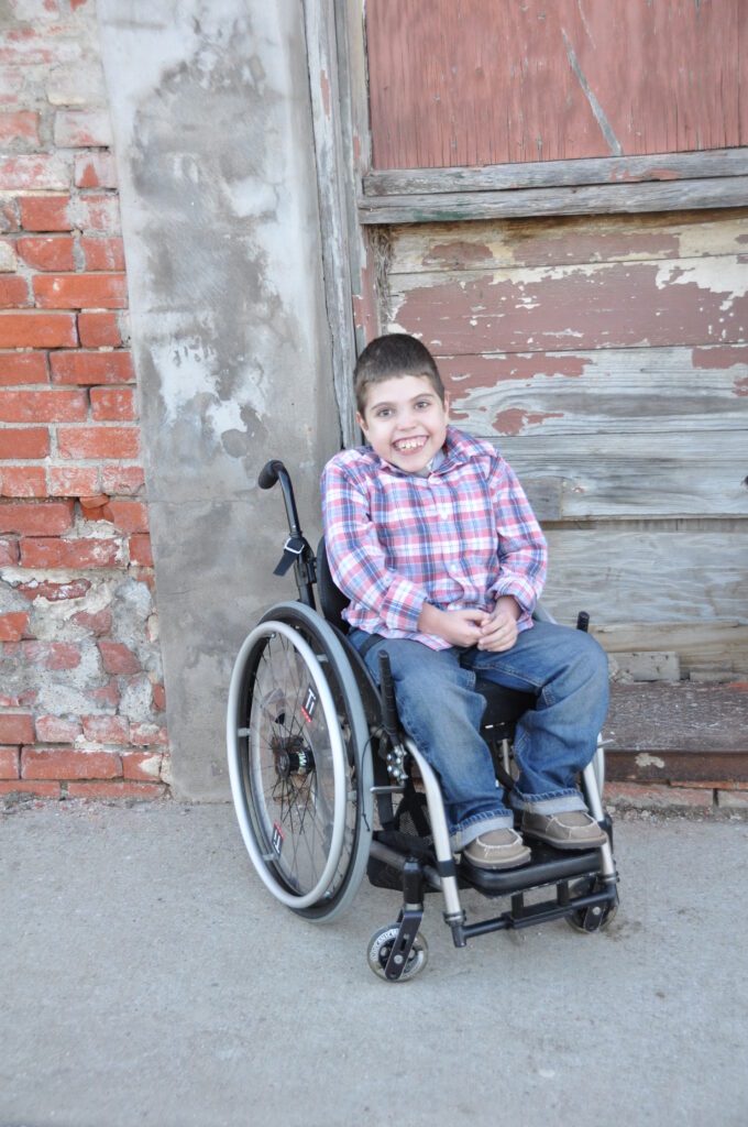 Happy kid in wheelchair