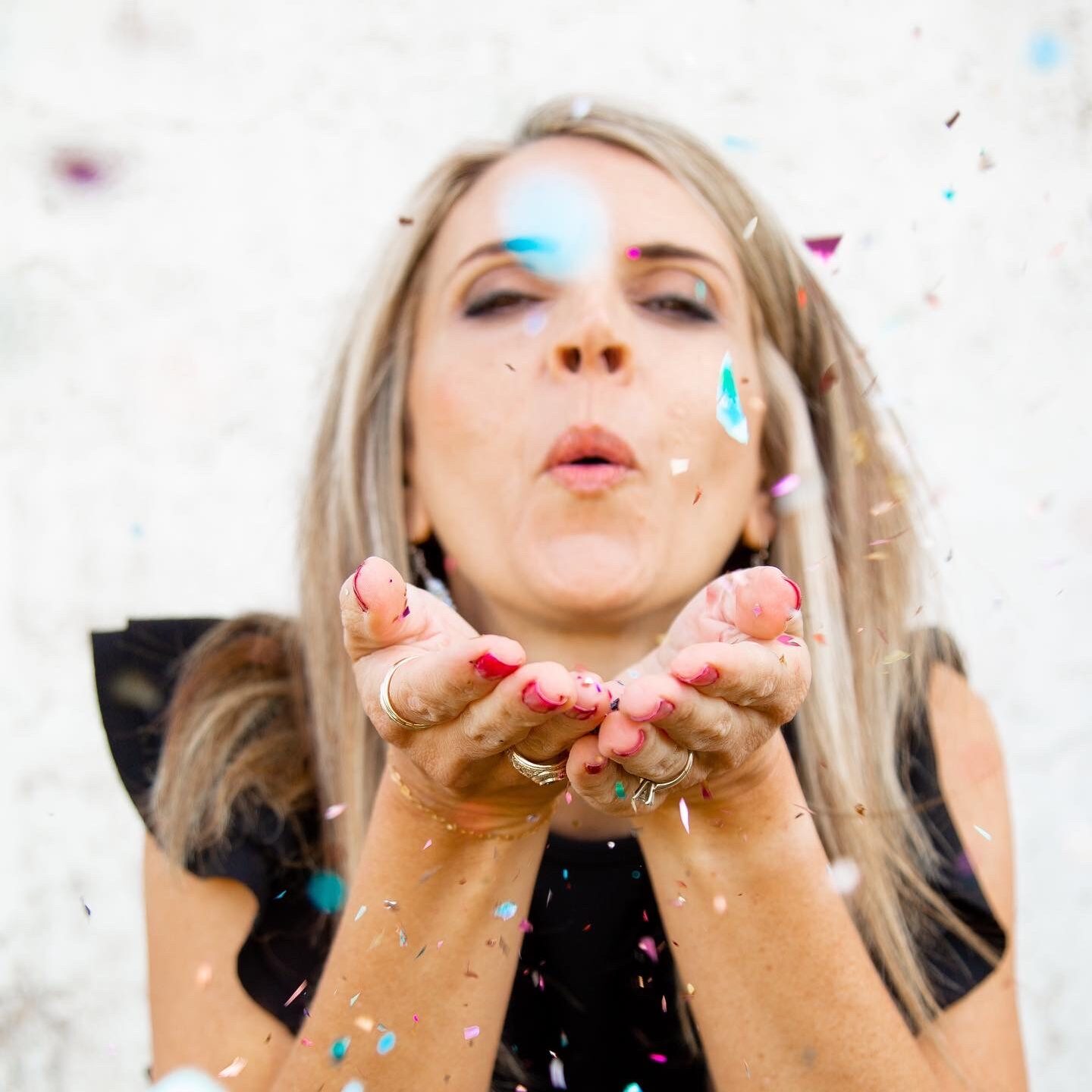 Woman celebrating with confetti